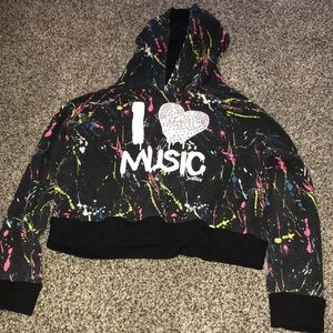 Black hoodie that says “I 💟 music”
